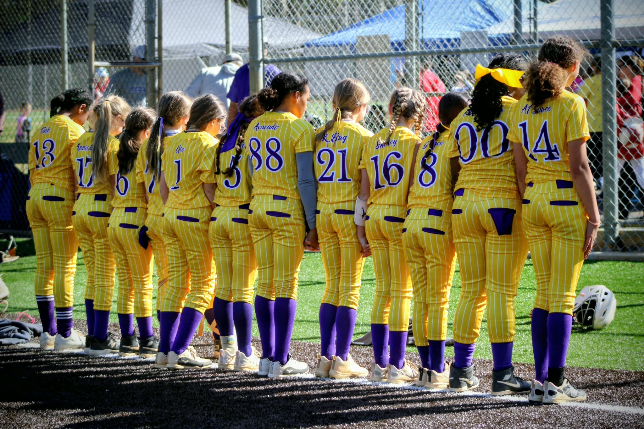 Monroe Mustangs team lined up in yellow uniforms