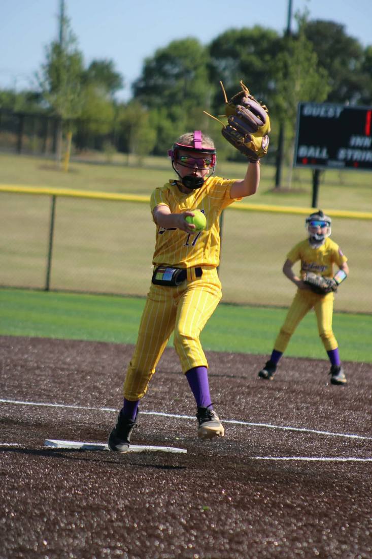 Mustangs pitcher delivering a pitch